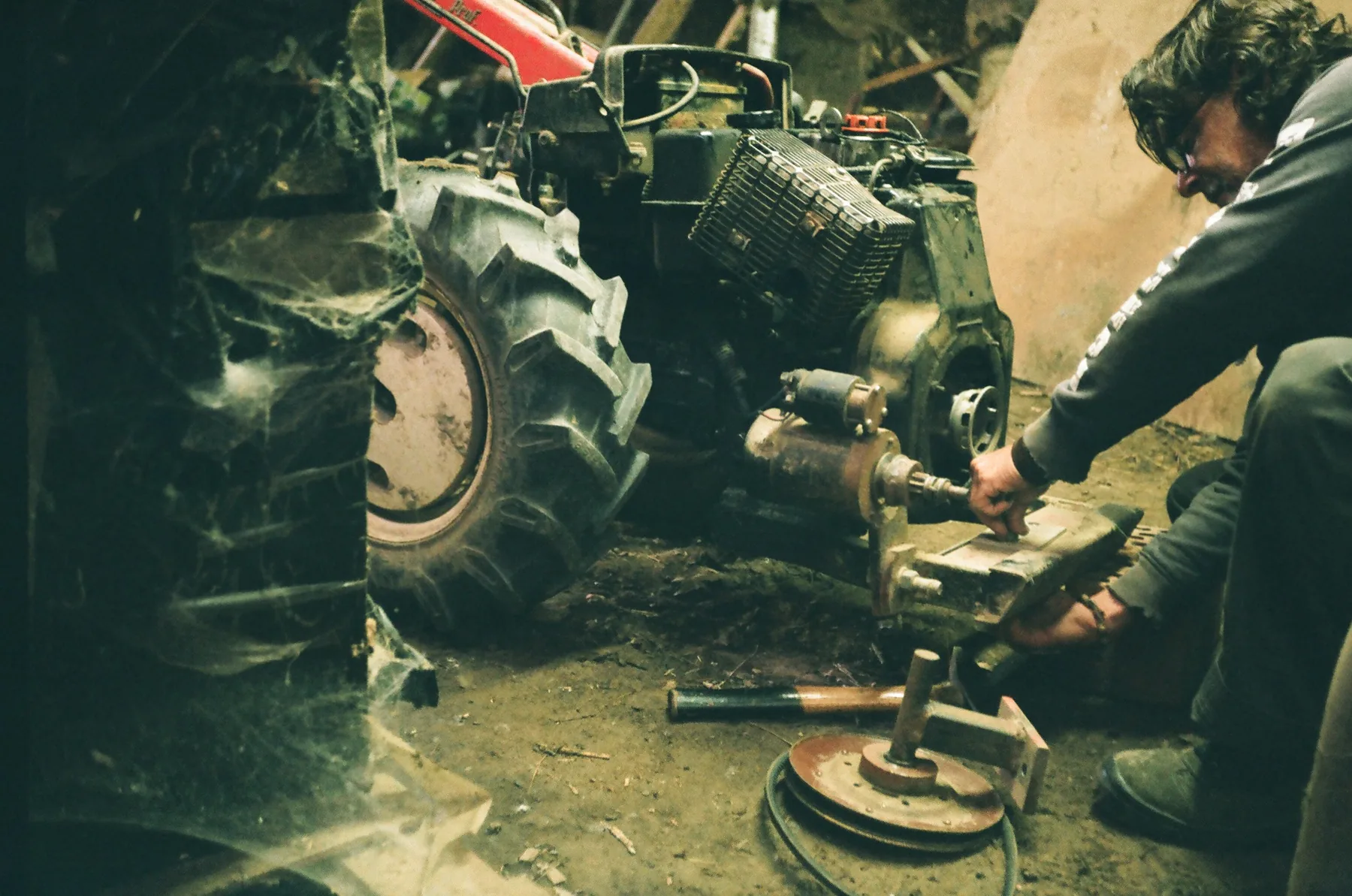 Mechanic repairing agricultural machinery